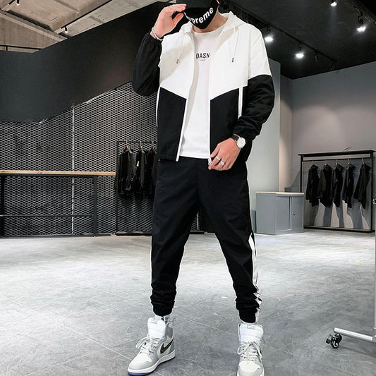 https://cdn.shopify.com/s/files/1/0879/0949/9227/files/Heren_Trainingspak_Sportieve_Tweedelige_Set_met_Windjack_en_Joggingbroek_T-E2.jpg?v=1742392593